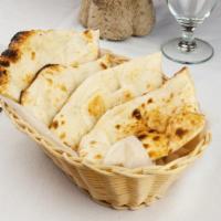 Naan · Unleavened flour bread baked in a tandoor oven.