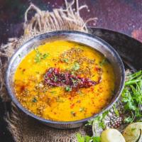 Dal Tadka · Yellow lentils cooked with onions, tomatoes, ginger and garlic.