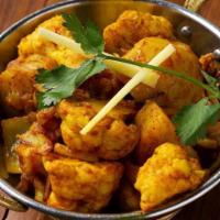 Aloo Gobi · Cauliflower and potatoes cooked with onions, tomatoes, Indian herbs and spices.
