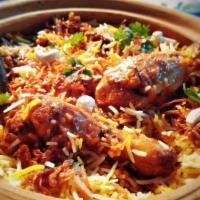 Chicken Biryani · Long grain aromatic basmati rice cooked with mixed chicken. Flavored with Indian herbs and s...
