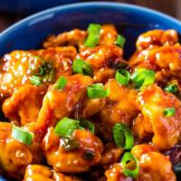 Gobi Manchurian · Batter-fried cauliflower sauteed with onions, ginger, garlic and cooked in a Manchurian sauce.