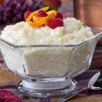 Kheer · Rice pudding. Long grain aromatic basmati rice cooked in milk and seasoned with cardamom. Se...