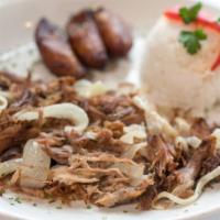 Lechon Asado · Roast pork. Oven roasted shredded pork, marinated and then grilled with sauteed onions. Serv...