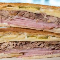 Sandwich Cubano - Cuban Sandwich · Served with french fries.