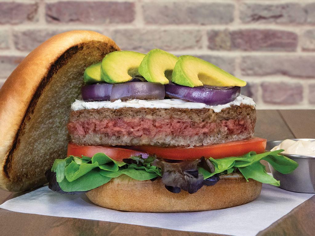 New Impossible Burger · Impossible burger, herbed goat cheese, mixed greens, tomatoes, grilled red onion, avocado, garlic aioli, brioche bun
