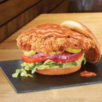 Nashville Hot · southern fried chicken, buttermilk brined, lettuce blend, tomatoes, red onions, pickles, may...