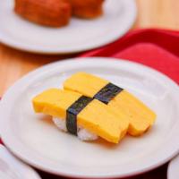 2PC Tamago Sushi · 2 pieces of egg nigiri. Tamago is Japanese style of making a sweetened rolled egg omelette o...