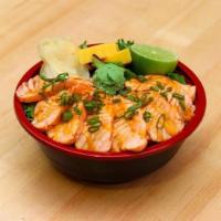 Seared Salmon Bowl · The Seared Salmon Bowl contains rice and mixed greens. It contains 1 scoop of raw salmon pok...