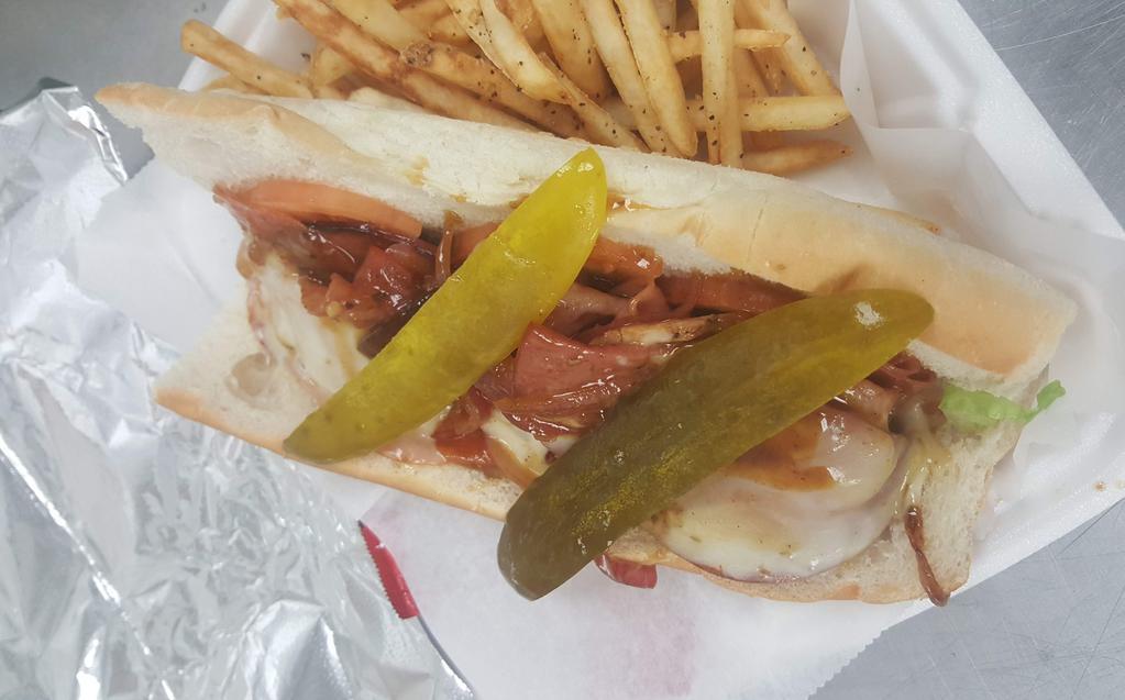 8. F What You Heard Cuban · Sauteed onions and garlic, 2 types of salami, ham, capicola, sliced pork chop, pepper jack, romaine, and tomato on a Cellone's hoagie bun with a small fry.