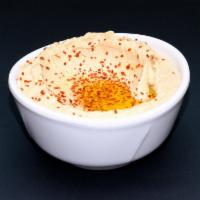 Hummus Dip · Served with pita bread.  