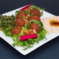 Vegetarian Platter · A hearty platter of falafel, hummus and tabbouleh with a side of pickles, tomatoes and tahin...
