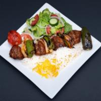 SHISH kabab · Fillet with Mediterranean seasonings. Served with rice and salad ,tomato,jalapeño and pita b...