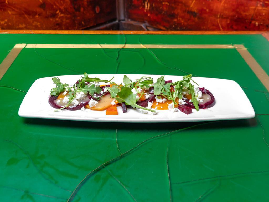 Beet Salad  · Roasted red and gold beets, baby mache, goat cheese and light champagne vinaigrette.
