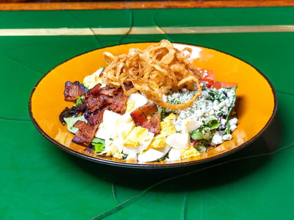Cobb Salad  · Grilled chicken, diced tomatoes, avocado, hard boiled eggs, applewood smoked bacon, crumbled blue cheese, mixed greens and ranch dressing .