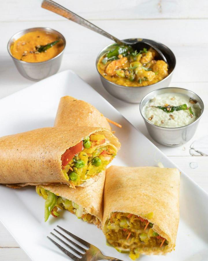 Paneer Spring Dosa · (GF) (VEG) Savory rice and lentil crepes service with fresh coconut & tomato chutneys and sambar (lentil soup) Seasonal vegetables, cottage cheese sauteed with spiced potatoes