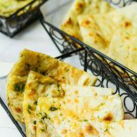 Classic Naan · Traditional flat breads cooked in our tandoor clay oven