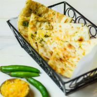 Chilli Cheese Naan · Traditional flat breads cooked in our tandoor clay oven