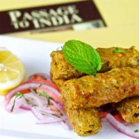 Seekh Kabab · Charbroiled succulent minced lamb rolls.
