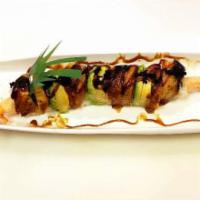 R40. Black Dragon Roll · Shrimp tempura, cucumber, topped eel, tobiko and eel sauce.