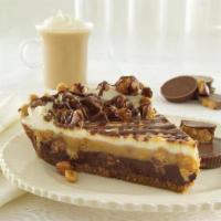 REESE'S CHOCOLATE PEANUT BUTTER PIE · The popular candy bar in a pie! Dark chocolate and peanut butter mousse full of Reese’s® Pea...