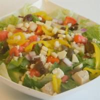 Greek · Grilled chicken, feta cheese, black olives, tomatoes, red onions, cucumbers on romaine or ic...