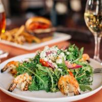 Shrimp Salad · Grilled garlic-marinated jumbo shrimp, baby kale, fresh corn, grape tomatoes, bleu cheese, p...