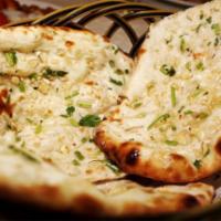 Garlic Basil Naan · Flat bread topped with garlic and basil.