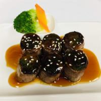 Beef Negimaki Appetizer · Sliced beef rolled with scallion and broiled with teriyaki sauce.
