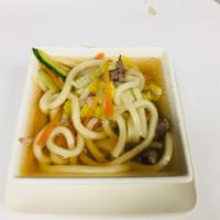 Udon (Sauteed or In Broth) · Served with choice of meat, pan fried/in broth Udon with mixed vegetables.