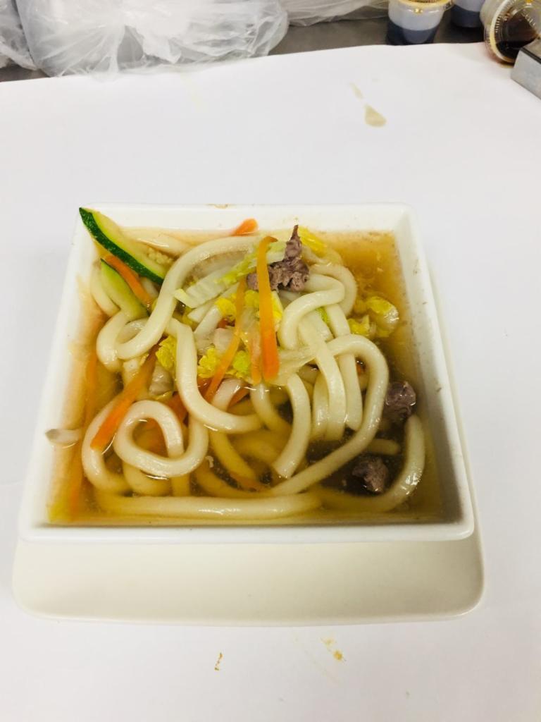 Udon (Sauteed or In Broth) · Served with choice of meat, pan fried/in broth Udon with mixed vegetables.