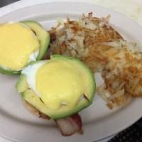 California Benedict · Crisp applewood smoked bacon, sliced tomato, and avocado on an English muffin, topped with t...