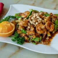 H12. Kung Pao Triple Delight · Shrimp, chicken and beef prepared in a traditional spicy kung pao sauce with chili peppers, ...