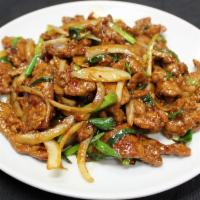 B5. Mongolian Beef · White and green onions. Spicy.