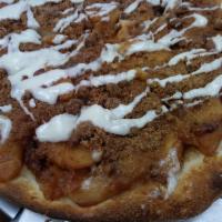 Apple Pie Pizza · Our own apple pie filling atop our hand tossed pizza crust, covered with crumble topping and...