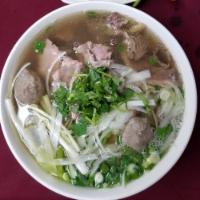 1. Special Combination Noodle Soup · Slices of eye round, flank, shredded tripe, tendon and meatballs.