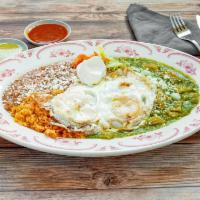 Huevos Divorciados · 3 eggs over easy, served with red and green salsa with Cotija cheese. Served with flour or c...