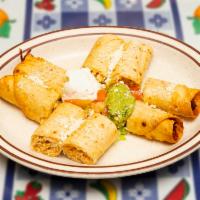 Chicken Taquito · Deep fried flour tortilla, filled with chicken, cut in  bite-sized pieces and garnished with...