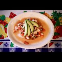 Tostada Shrimp Ceviche · Shrimp marinated in lime juice mixed with cilantro, chopped onions and diced tomato. Topped ...