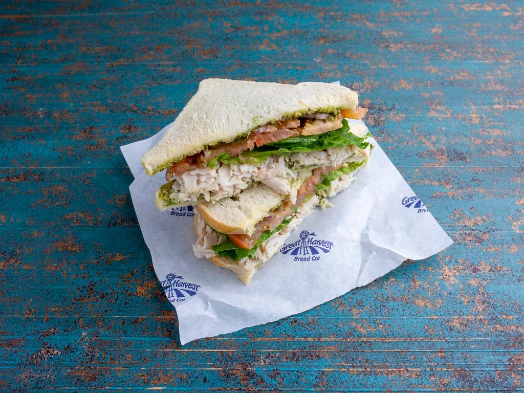 Turkey Pesto Sandwich · Freshly sliced turkey and pesto sauce  with provolone cheese. Topped with  lettuce, tomato, and red onion. Then  finished off with our own balsamic  drizzle grilled on sourdough bread.
