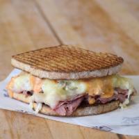 The Reuben Sandwich Combo · Pastrami, Swiss cheese, sauerkraut, and Thousand Island dressing grilled on pumpernickle. A ...