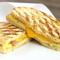 Breakfast Sandwich Combo · Choice of meat, with Egg, cheddar,  with tomato, green pepper, and red onion, garlic butter ...