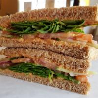 Vegas Veggie Sandwich · Our hummus spread on toasted honey whole wheat bread,  with fresh spinach, tomato, cucumber,...
