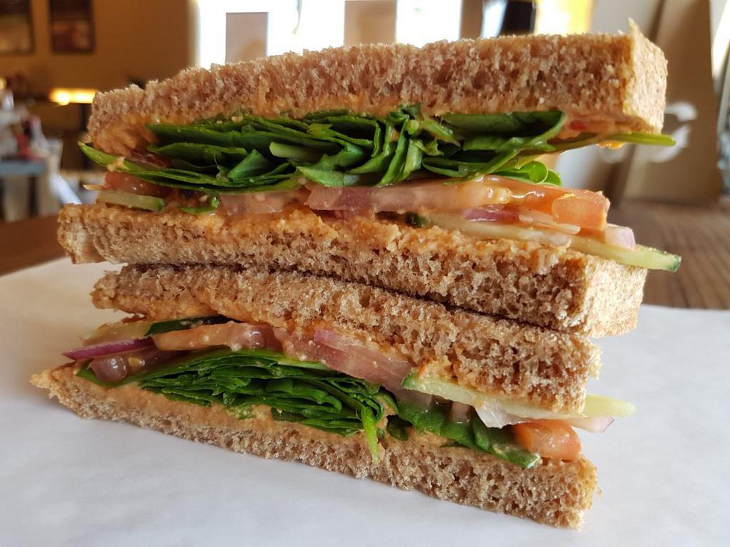 Vegas Veggie Sandwich Combo · Our hummus spread on toasted honey whole wheat bread,  with fresh spinach, tomato, cucumber, red onion and topped with our unique balsamic drizzle.