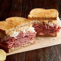 Reuben the Great · 1/2 lb. of hot corned beef or pastrami, Swiss, sauerkraut, Thousand Island dressing and gril...