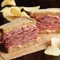 Hot Corned Beef Sandwich · 1/2 lb. of hot corned beef and choice of bread. Served with chips or baked chips.
