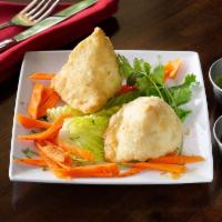 Vegetable Samosa · Crisp, savory pastries filled with spiced potatoes and green peas. Vegan.