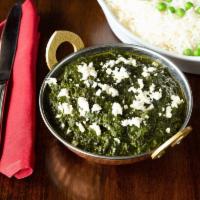 Palak paneer · Creamy spinach cooked with homemade Indian cheese.