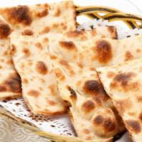 Plain Naan · Traditionally baked bread in clay oven.