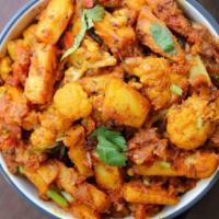 VEGAN ALOO GOBI (POTATO & CAULIFLOWER) · Potatoes & Cauliflower cooked with onion & tomato sauce (Veganly made) in a perfect combinat...