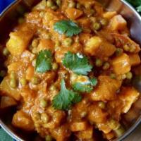 Aloo & Kerau (Potato & Peas) · Potatoes & Green peas cooked with onion & tomato gravy in a cream sauce  with perfect combin...